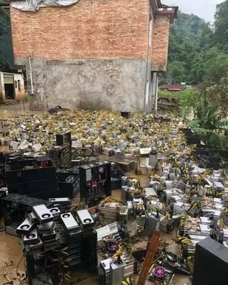 A view of a mining farm with rows of mining rigs, highlighting the scale and infrastructure required for efficient mining operations.